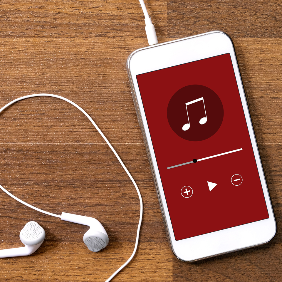 Photograph of a smart phones and earphoness - music being played